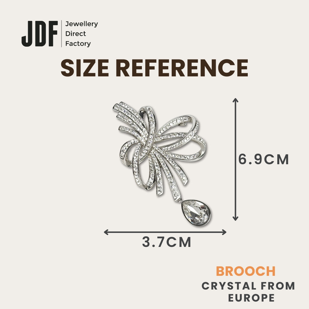 Elegant Crystal Ribbon Brooch with Crystals from Europe, Brooch, Size Reference, Crystals from Europe, One-Year Warranty - Jewellery Direct Factory in alabaster background