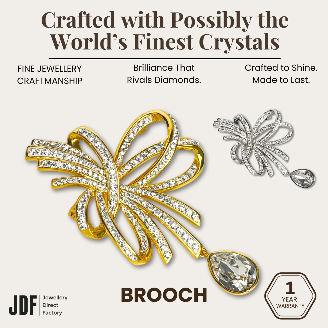 Elegant Crystal Ribbon Brooch with Crystals from Europe, Brooch, White Gold, Yellow Gold, Crystals from Europe, One-Year Warranty - Jewellery Direct Factory in alabaster background