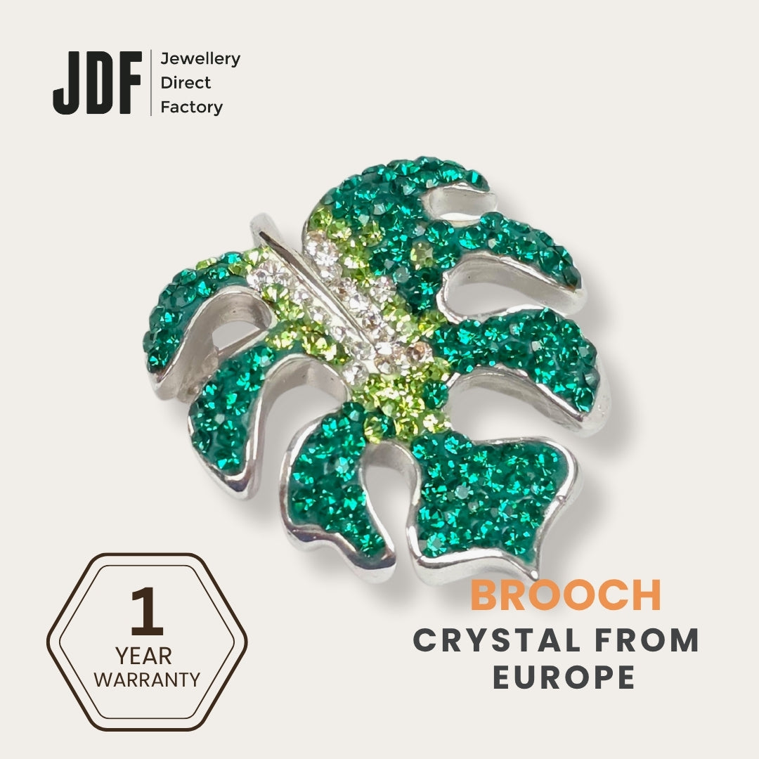 Iconic Monstera Leaf Brooch with Crystals from Europe, Brooch, Green, Crystals from Europe, One-Year Warranty - Jewellery Direct Factory in alabaster background