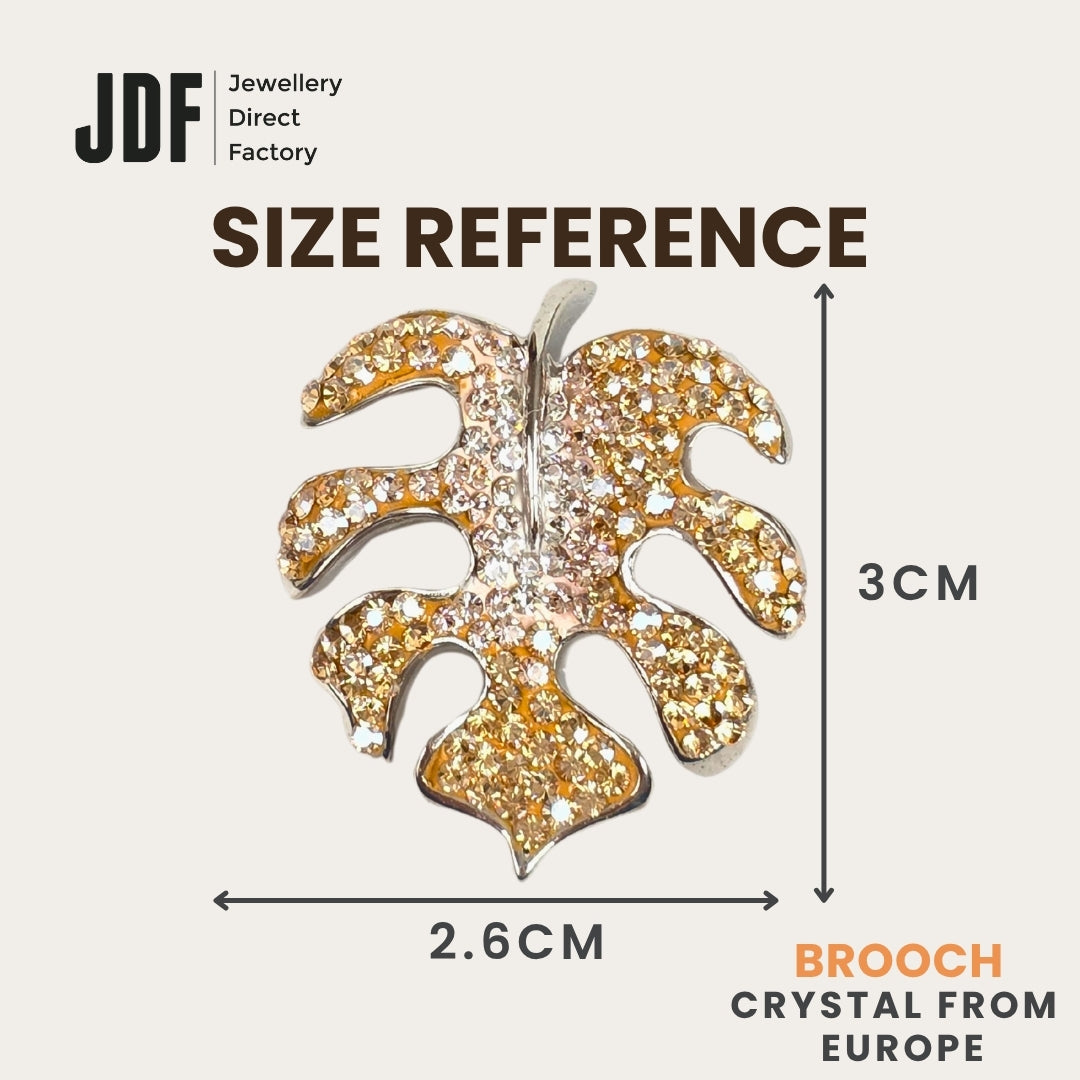 Iconic Monstera Leaf Brooch with Crystals from Europe, Brooch, Size Reference, Crystals from Europe, One-Year Warranty - Jewellery Direct Factory in alabaster background