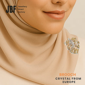Iconic Monstera Leaf Brooch with Crystals from Europe, Brooch, Worn on Tudung by Model, Crystals from Europe, One-Year Warranty - Jewellery Direct Factory in alabaster background