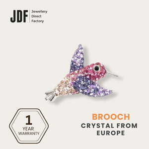 Hummingbird Brooch with Crystal From Europe, Brooch, Purple, Crystals from Europe, One-Year Warranty - Jewellery Direct Factory in alabaster background