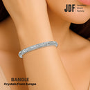 Sparkling European Crystal Bangle, Crystal Bangle, Worn by Woman Model, Crystal From Europe, One-Year Warranty - Jewellery Direct Factory in alabaster background
