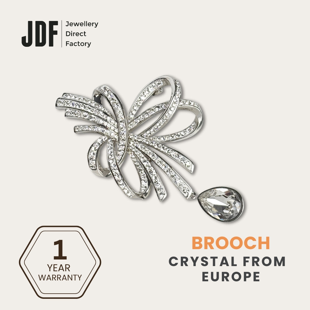 Elegant Crystal Ribbon Brooch with Crystals from Europe, Brooch, White Gold, Crystals from Europe, One-Year Warranty - Jewellery Direct Factory in alabaster background