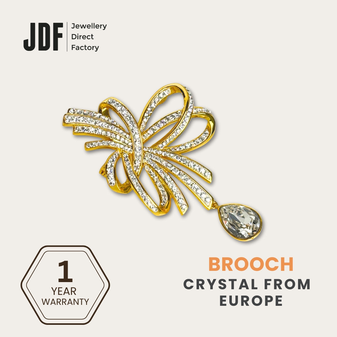 Elegant Crystal Ribbon Brooch with Crystals from Europe, Brooch, Yellow Gold, Crystals from Europe, One-Year Warranty - Jewellery Direct Factory in alabaster background