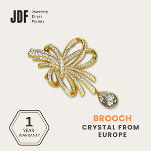 Elegant Crystal Ribbon Brooch with Crystals from Europe, Brooch, Yellow Gold, Crystals from Europe, One-Year Warranty - Jewellery Direct Factory in alabaster background