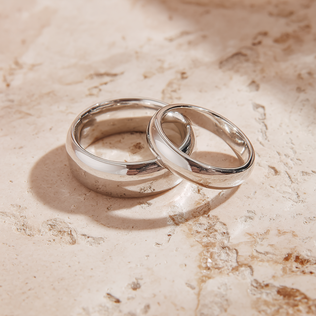 Wedding Bands / Rings in sand rought texture background
