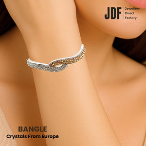 Twist Sparkle Bangle with Crystals From Europe, Crystal Bangle, Worn by Woman Model, Crystal From Europe, One-Year Warranty - Jewellery Direct Factory in alabaster background